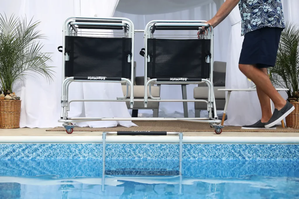 Multiple EdgeMate In-Pool Chairs are folded and stored on a rolling rack. Storage and portability are two important factors to consider when it comes to in-pool chairs vs. poolside lounge chairs.